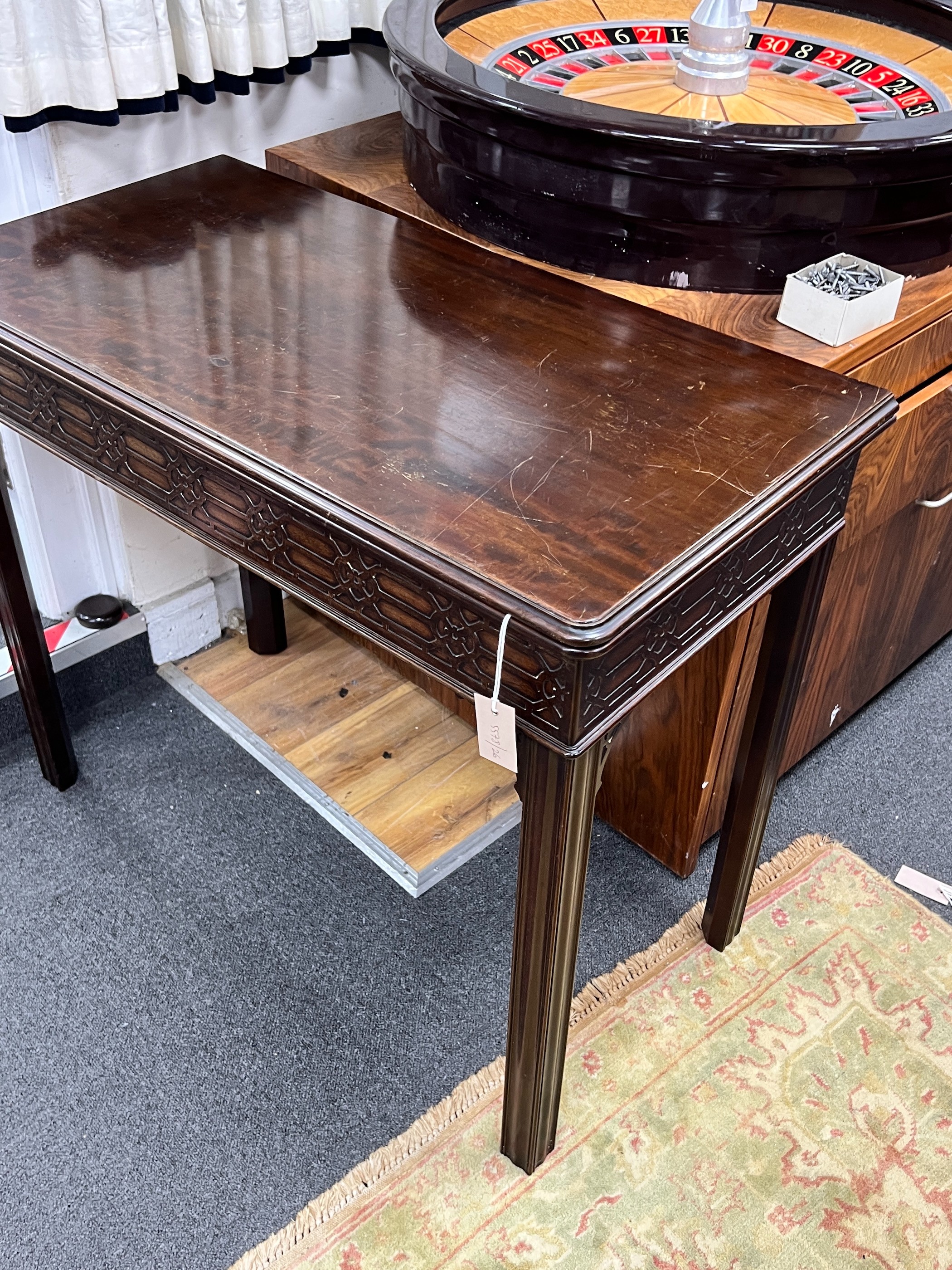 An Edwardian Chippendale revival rectangular mahogany folding card table, width 91cm, depth 46cm, height 76cm